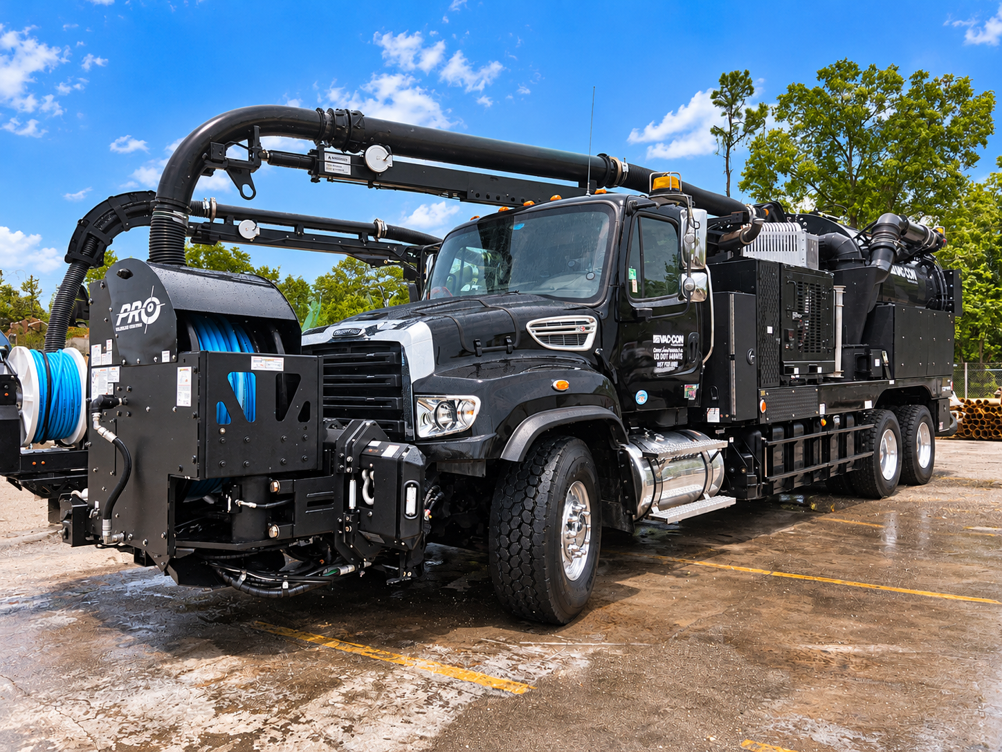 Black Vac-Con Vacuum Truck on Wet Lot