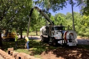 Daylighting Truck with 2 workers Hydro-excavating the ground